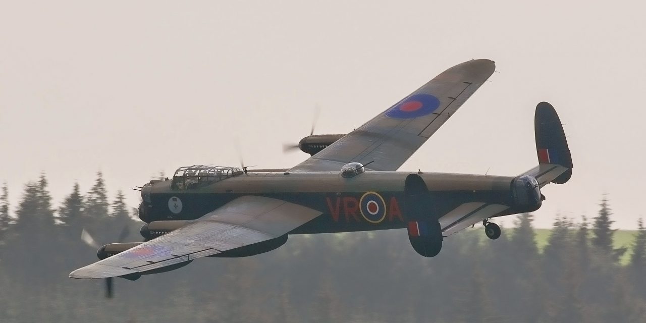 The two airworthy Lancaster fly low over Derwent Dam.