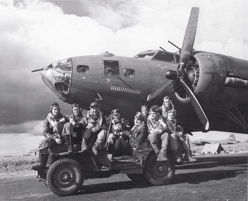 Air crew posing on Jeep in front of B-17F ‘Our Gang’ of 324th BS, 91st BG, US 8th Air Force, Bassingbourn, England,…