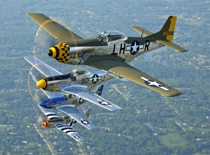 A formation of four P-51D Mustangs flying at the Thunder over Michigan 2012 airshow on August 3, 2012.
