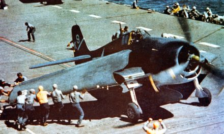 An F6F-3 aboard USS Yorktown has its “Sto-Wing” folding wings deployed for takeoff.