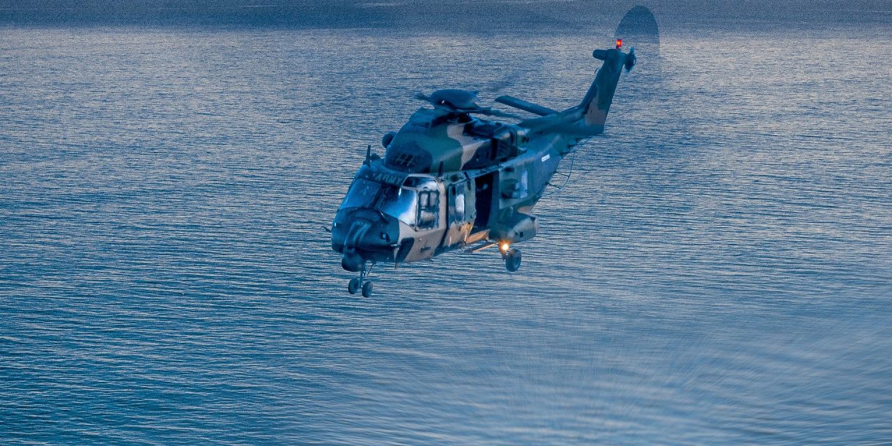 MRH-90 Taipan ( Airbus Helicopters) of the Australian Army off the Gold Coast beaches at dawn.