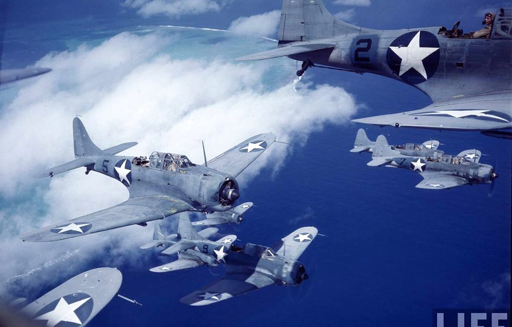 A squadron of SBD Dauntless dive bombers over the Pacific.