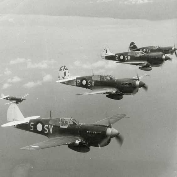 Australian P-40 Kittyhawk fighters in formation.