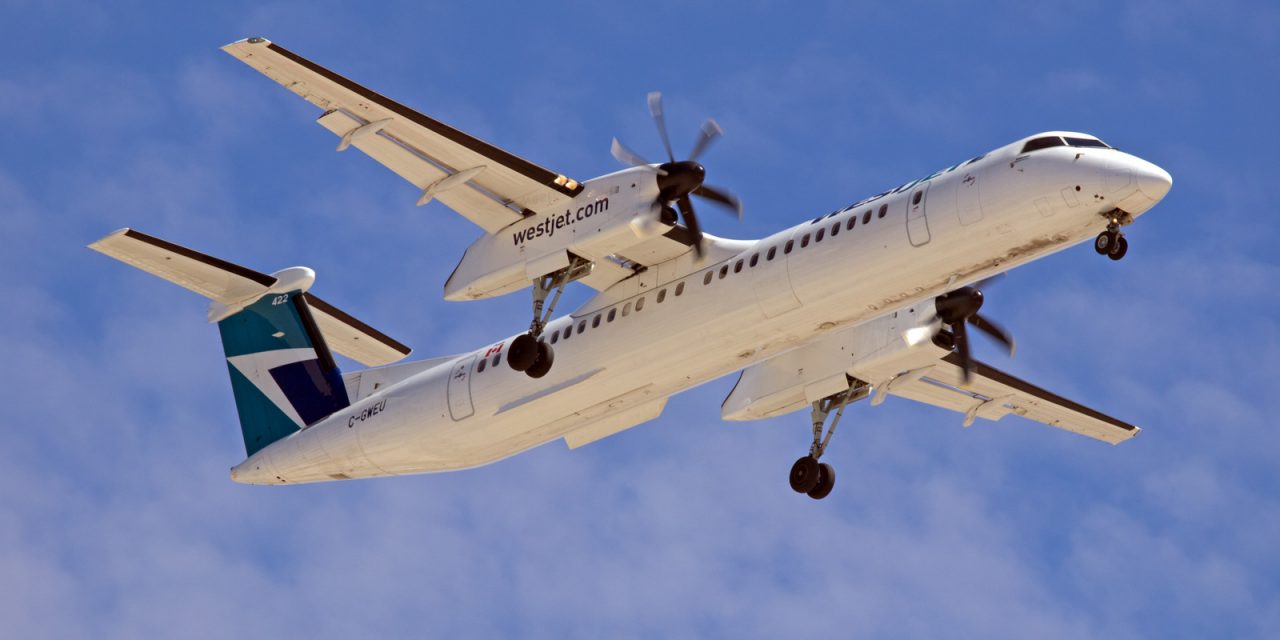 A WestJet Encore Bombardier Q400 caught on final approach to CYWG / Winnipeg.