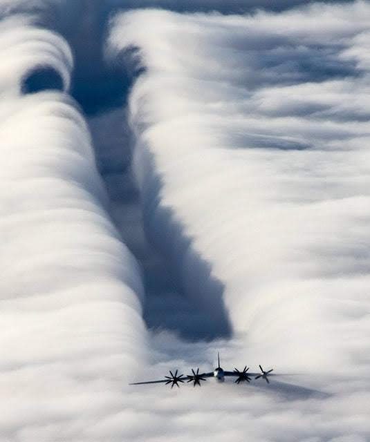 A Tu-95 flying through the clouds