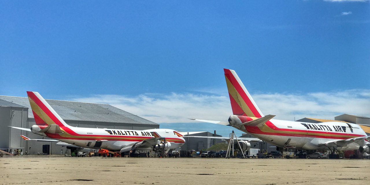 Two B747-400 freighters sit across the ramp, getting their A-checks worked.