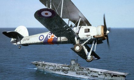 A Fairey Swordfish flies over HMS Ark Royal, 1939.