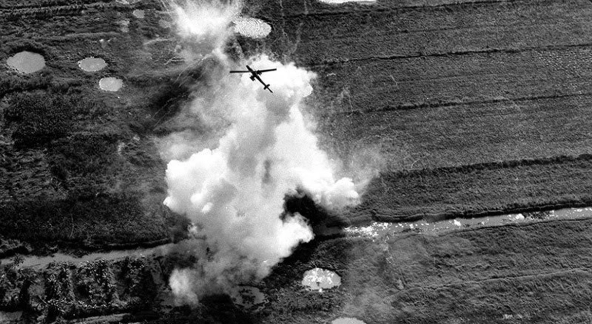 A Bell UH-1E Cobra pulling out of a rocket and strafing run on a Viet Cong position near Cao Lanh in the Mekong…