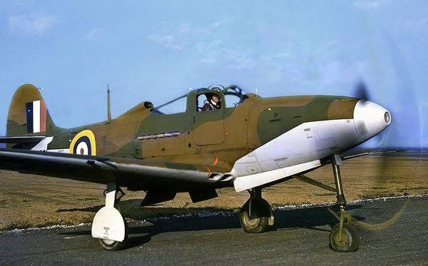 A Bell P-400 Airacobra (basically a P-39 with a 20mm cannon in the nose instead of a 37mm cannon) in RAF markings,…