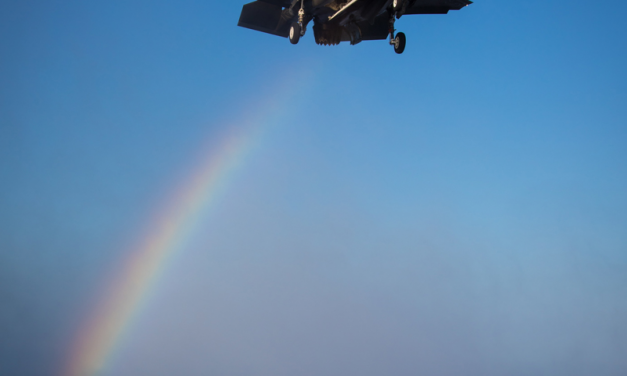 Trailing a rainbow an F-35B Lightning II about to land aboard the Royal Navy aircraft carrier HMS Queen Elizabeth…